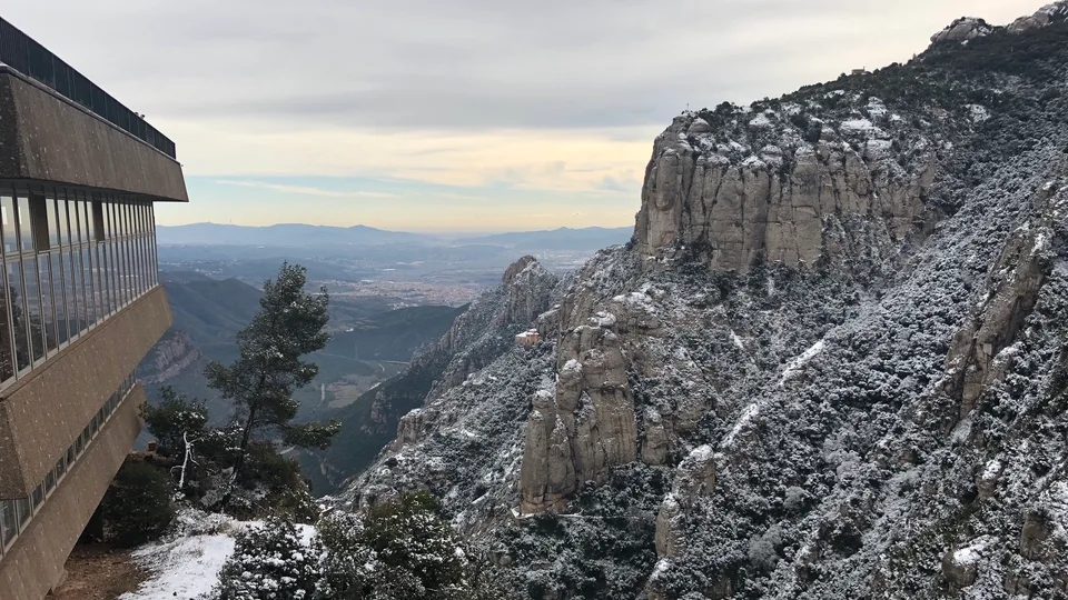 Snow-dusted mountains and valleys seen from Montserrat