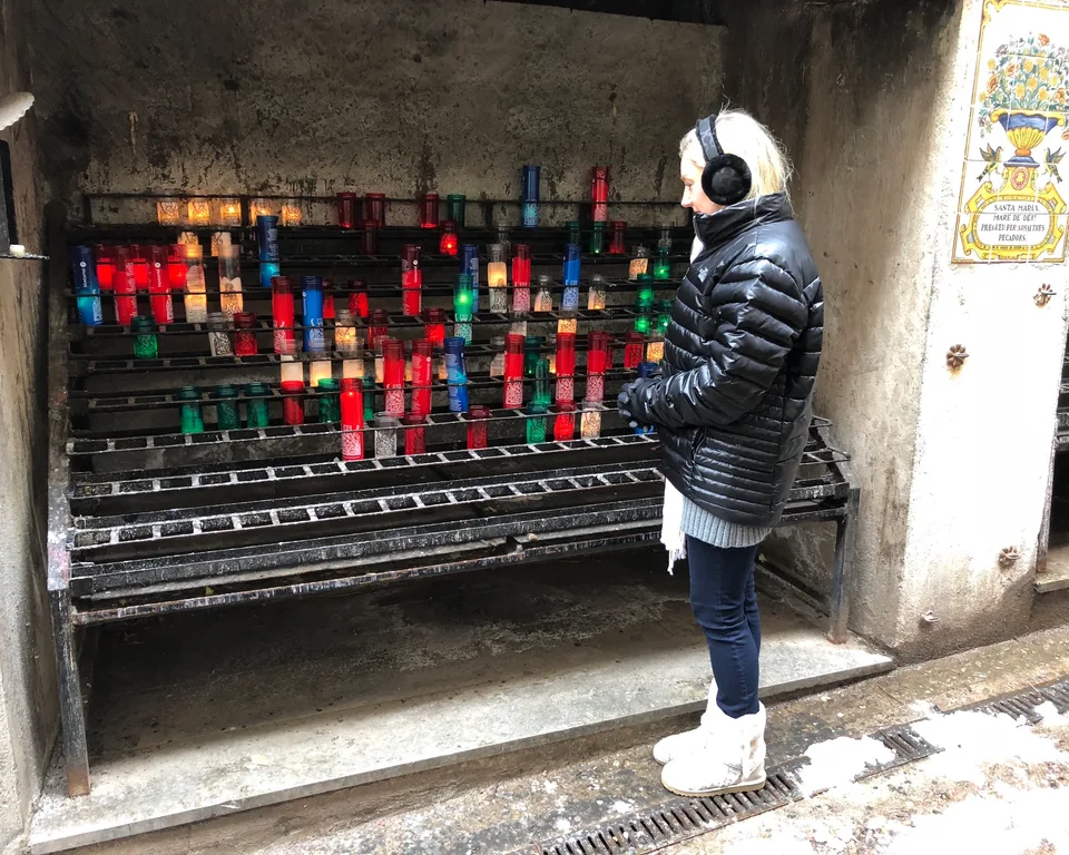 Rows of glowing votive candles at Montserrat