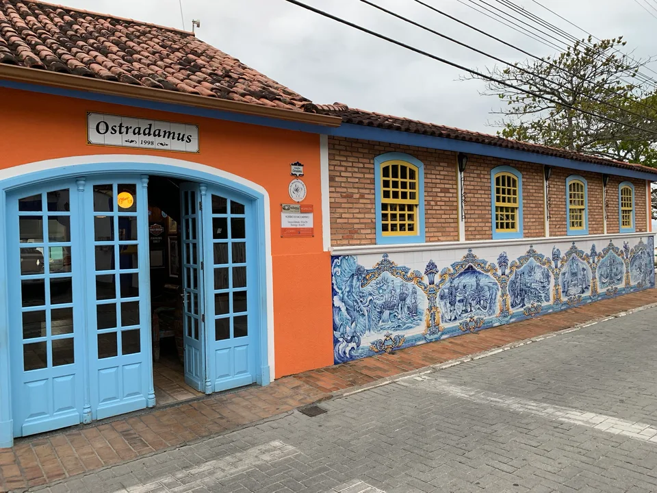 Ostradamus’s colorful restaurant frontage beside Ribeirão da Ilha