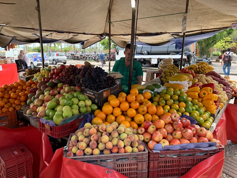 Colorful fruit and vegetables arranged at a market stall