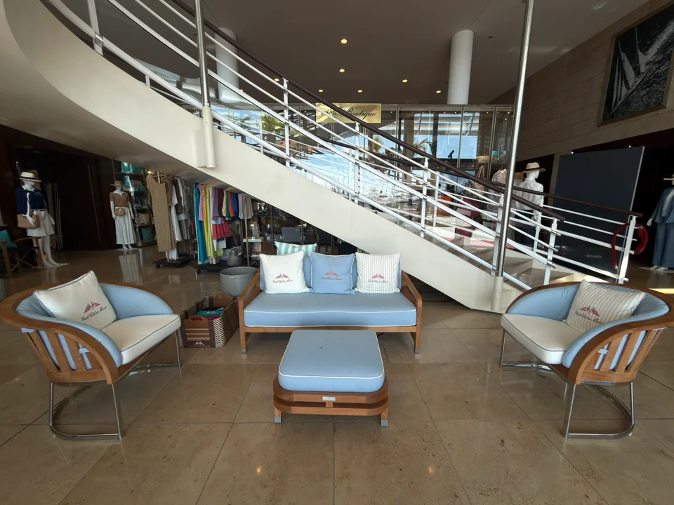 Lounge chairs and a staircase inside the yacht club