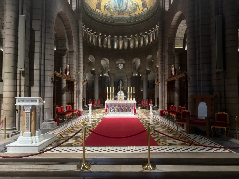 Columns, altar and domed apse inside Monaco Cathedral