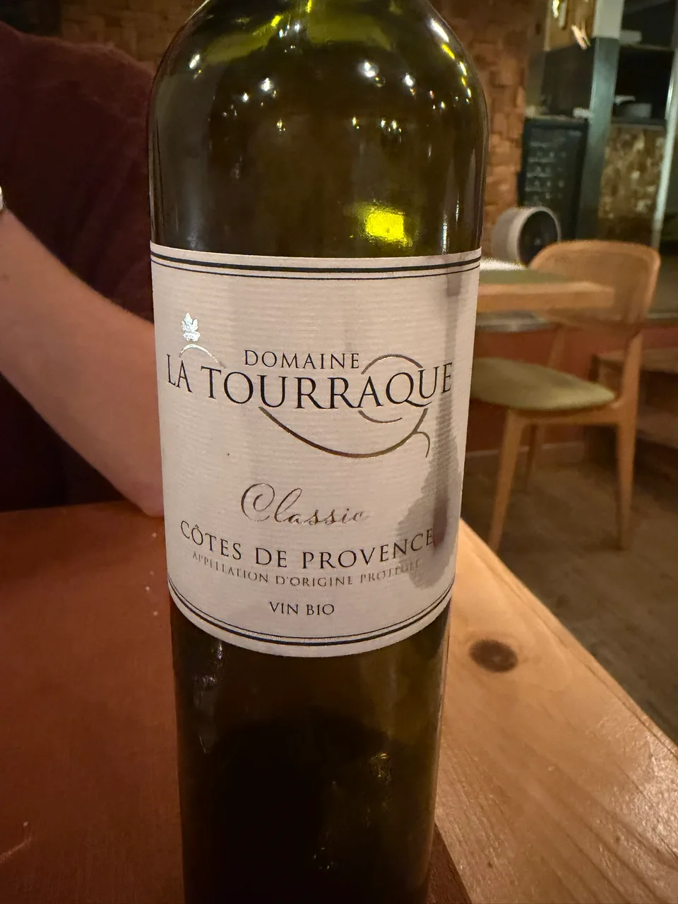 A bottle of French white wine on a restaurant table