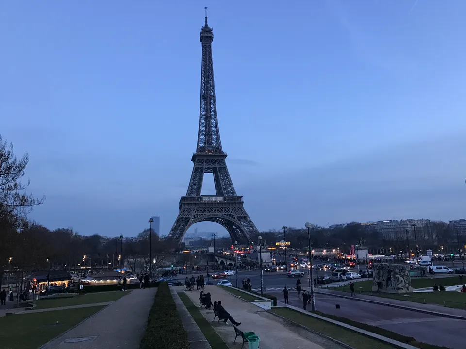 The Eiffel Tower rising above the Trocadéro gardens in winter twilight