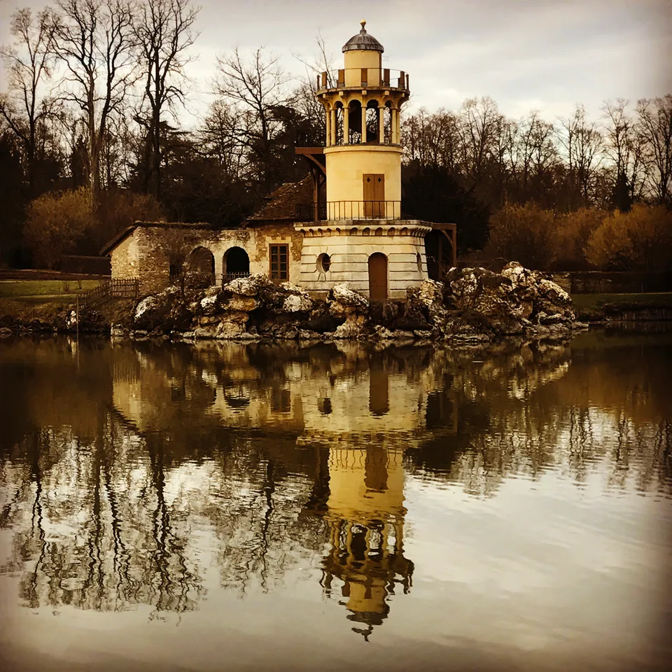 The Marlborough Tower reflected in the lake at the Queen’s Hamlet, Versailles