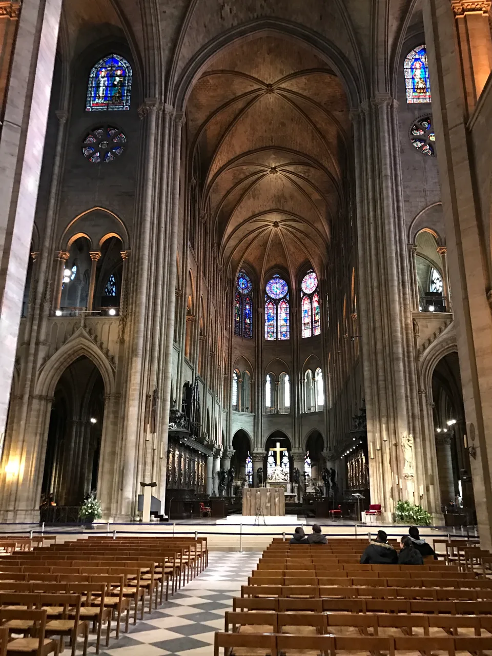 Rows of chairs and tall stone vaults inside Notre-Dame Cathedral before the 2019 fire