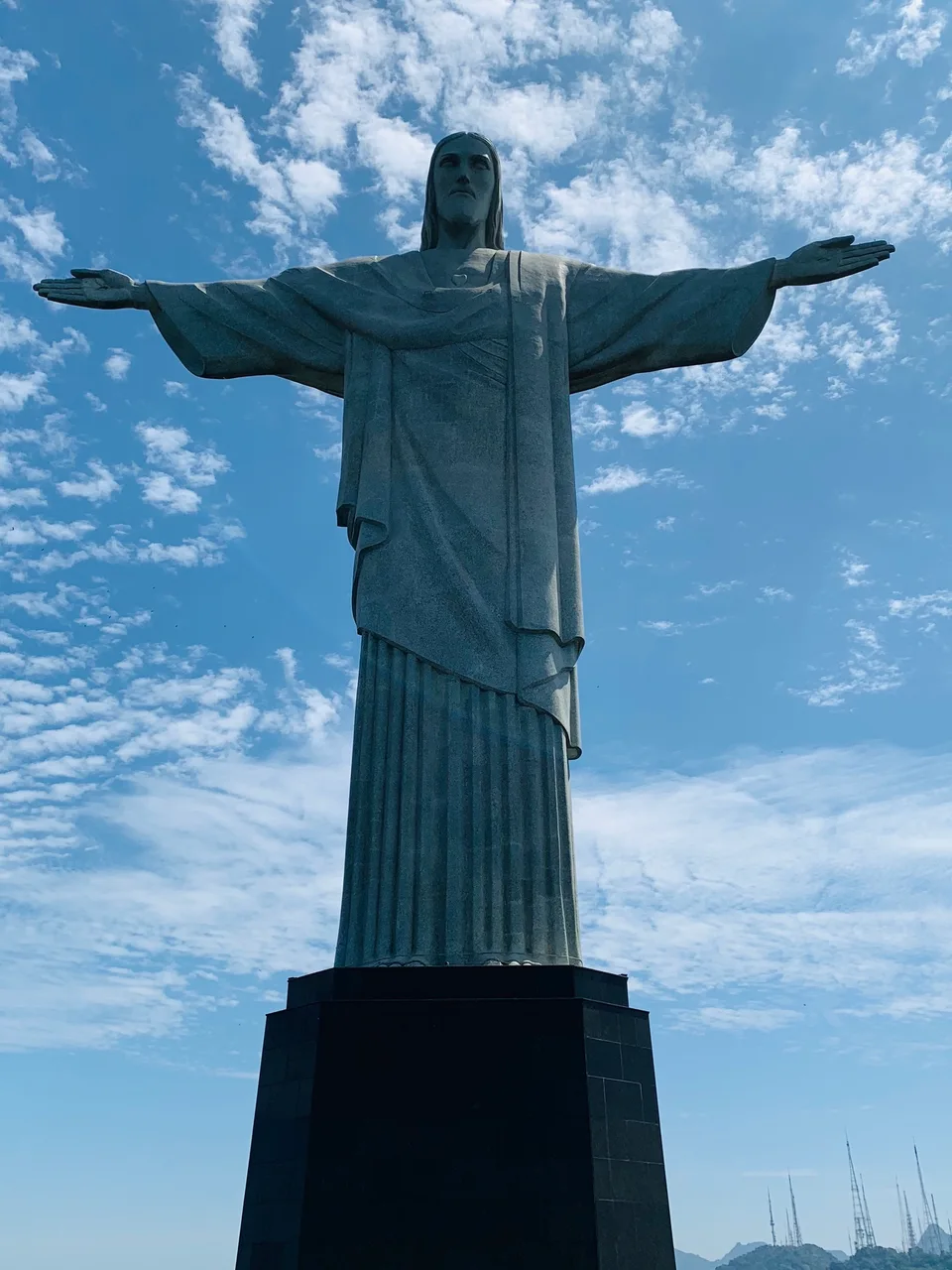 Christ the Redeemer’s statue beneath bright clouds on Corcovado