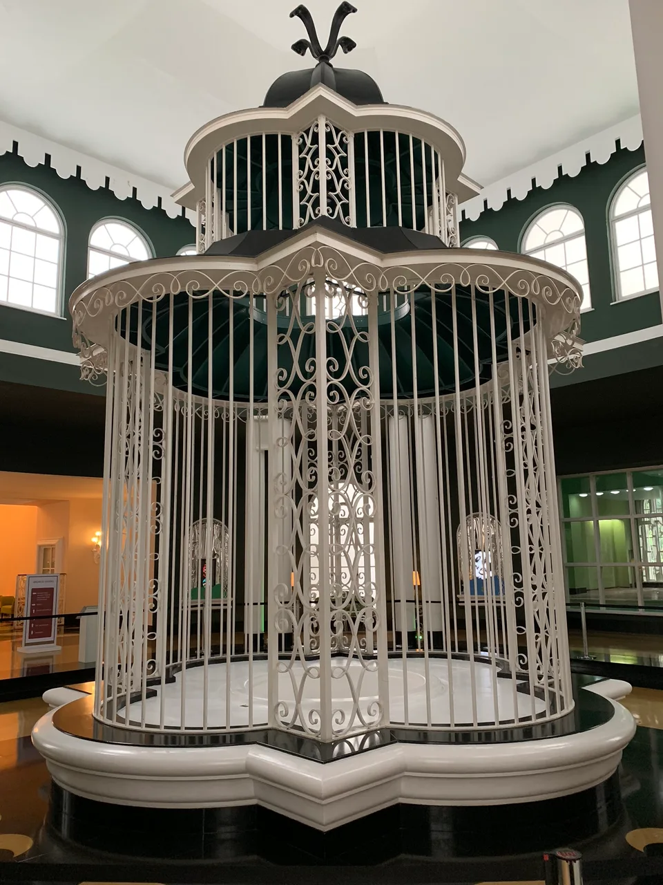 An ornate white clock and decorative interior at Quitandinha